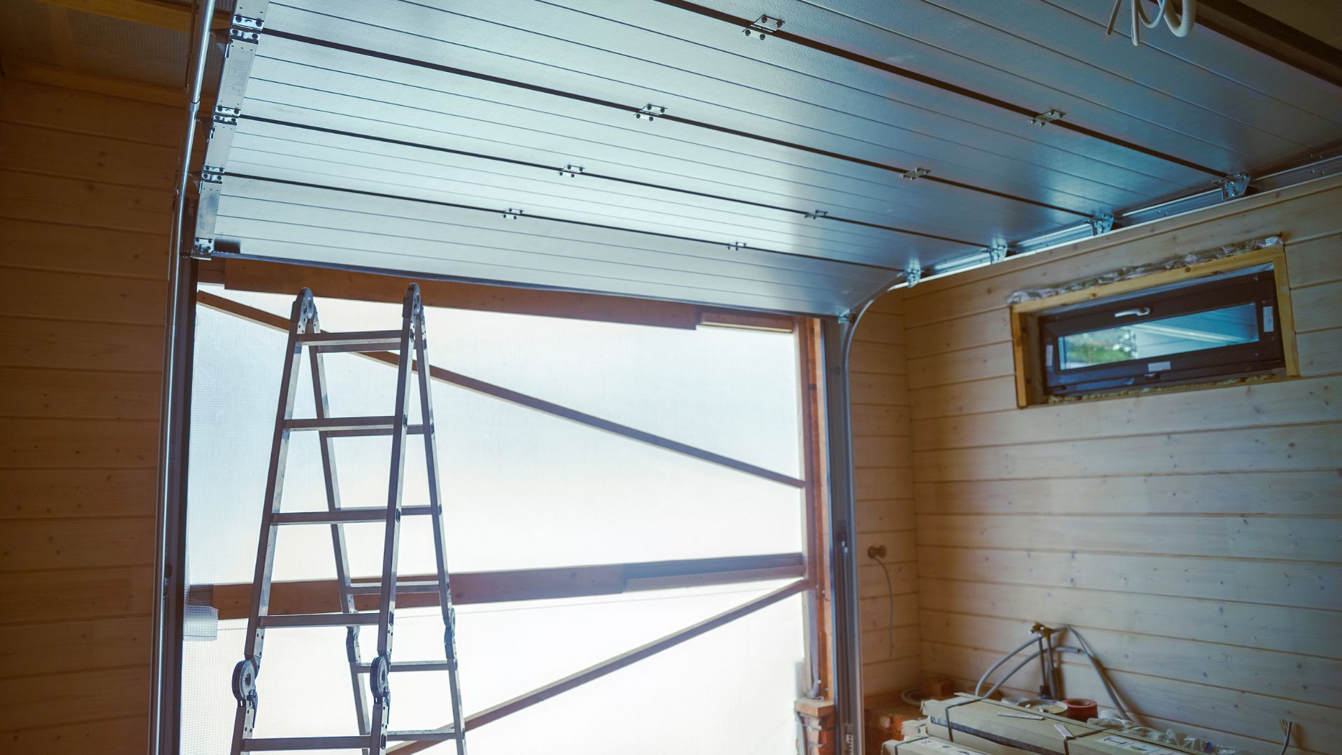 A ladder that is next to a window